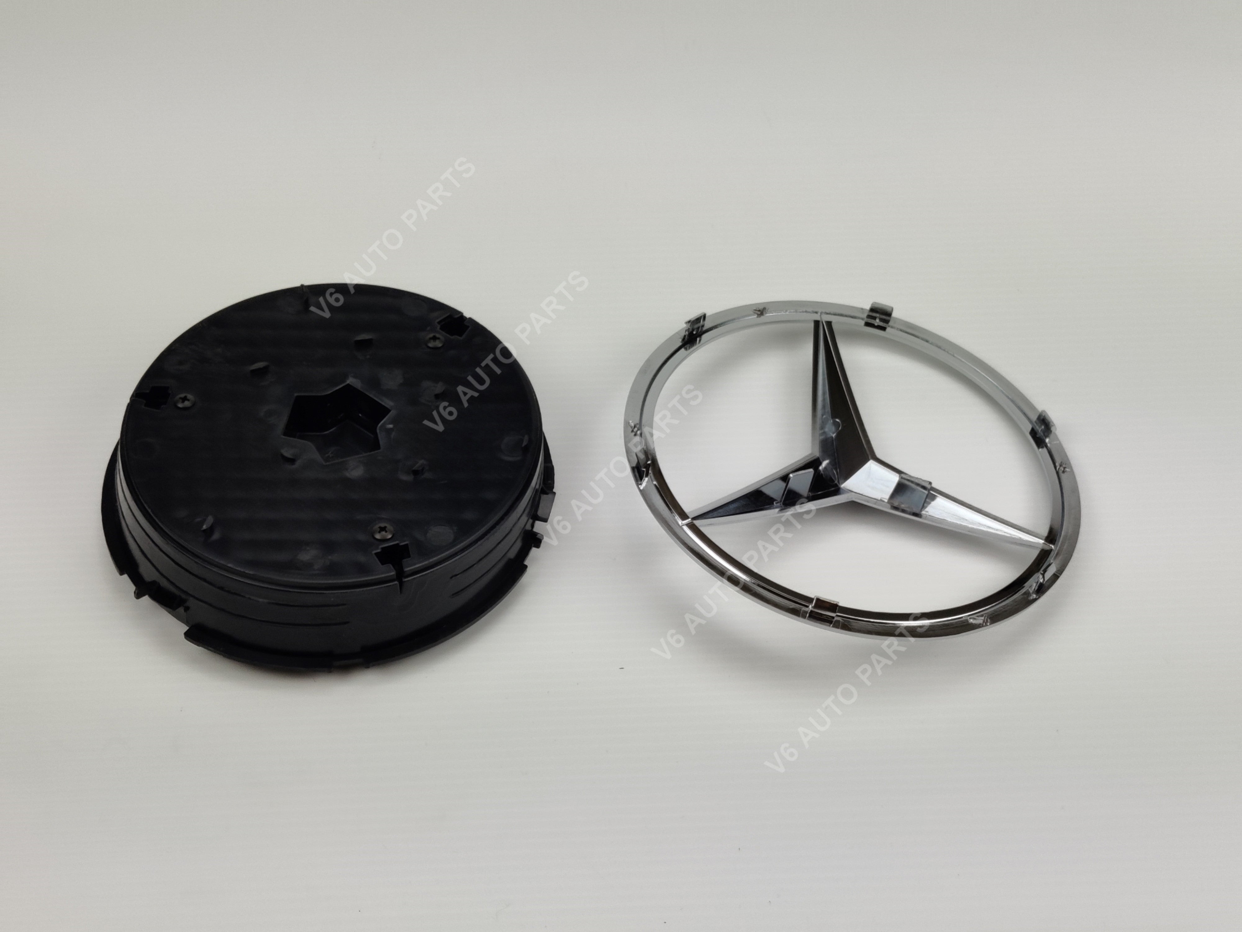 Image of Mercedes emblem and wheel cover featuring E1-C front grille emblem for GLA-Class X156 2013-2018.