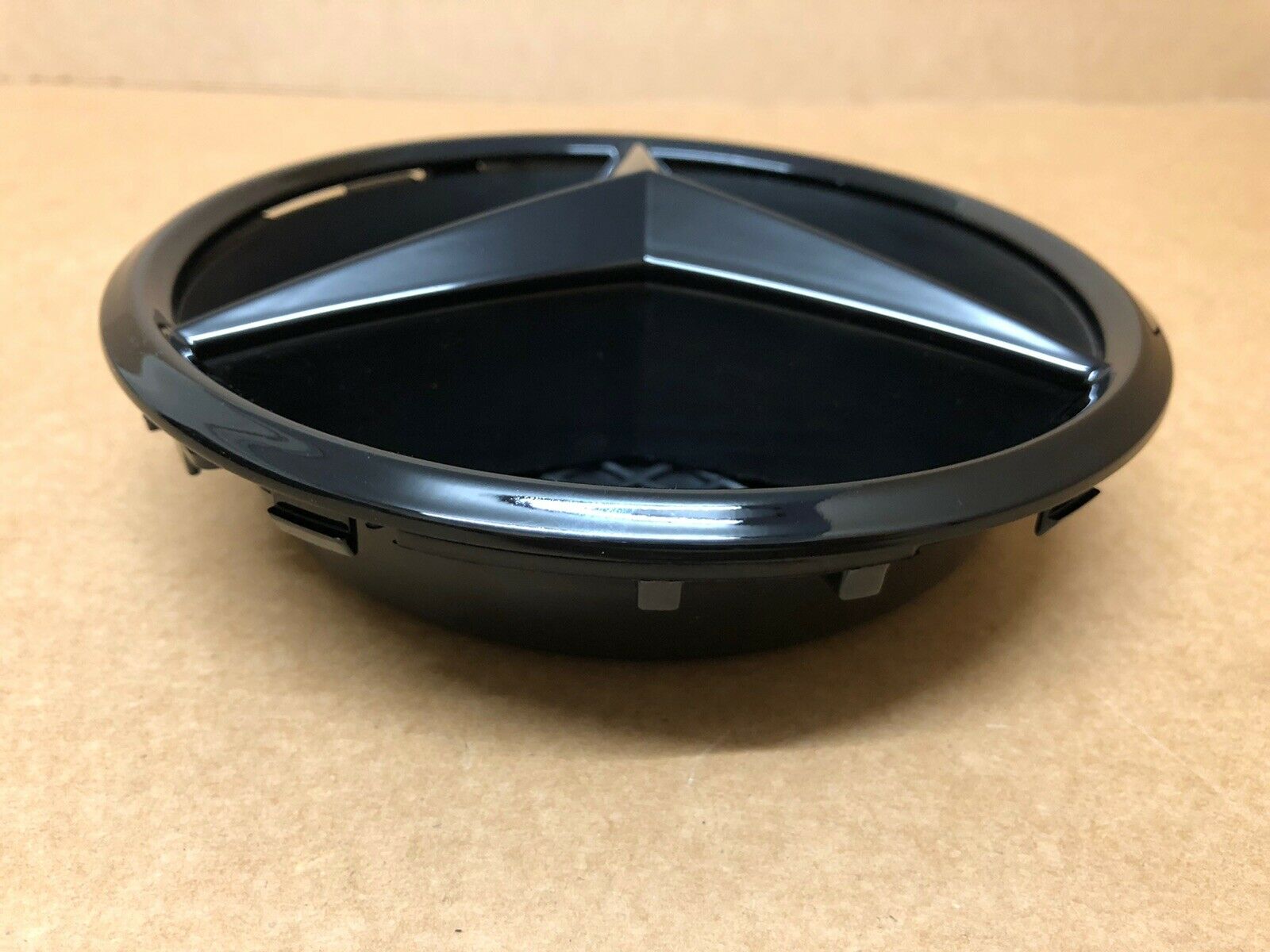 Table with black Mercedes emblem badge for 2016+ Benz E-Class W213 front grille.