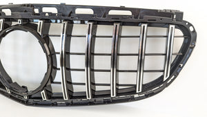 Black OEM Mercedes Grille with chrome bars.