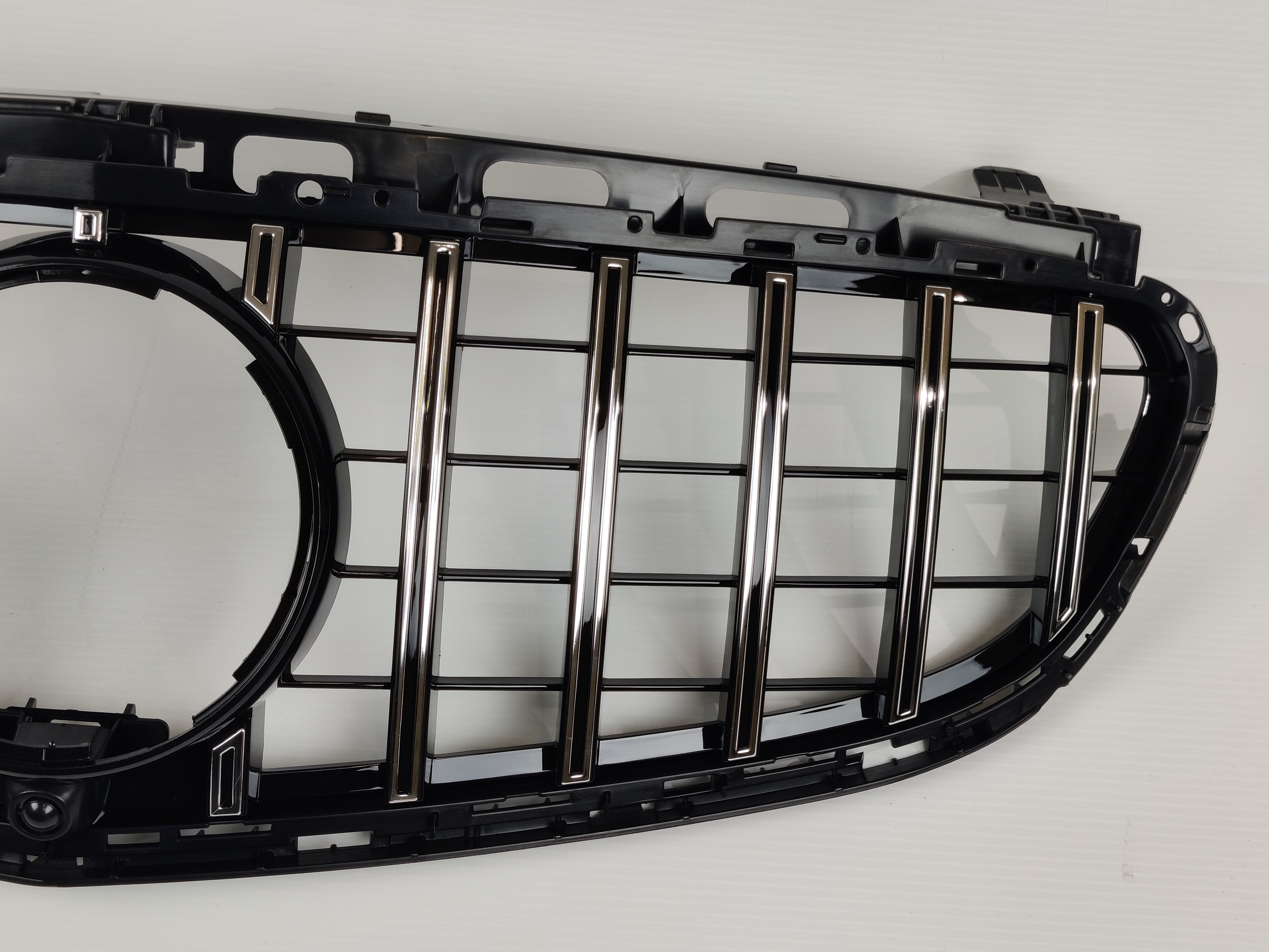 Black grille with chrome frame, Mercedes E-Class.